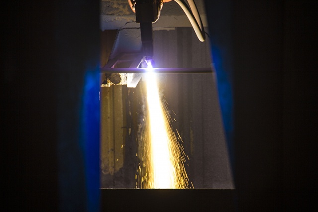 Sparks fly from the first piece of steel cut for Matsonia at NASSCO
