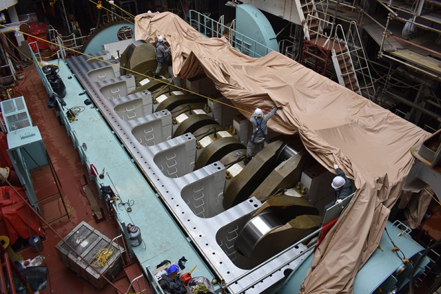 Philly Shipyard staff uncover the main engine bedplate in the engine room