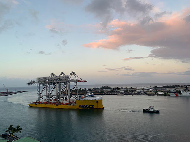 Sand Island cranes pulled into Honolulu Harbor by tug