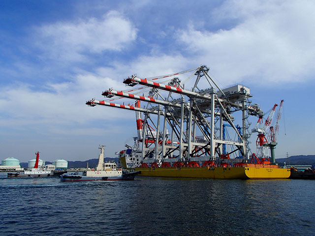 Cranes loaded onto barge in Japan depart for Sand Island