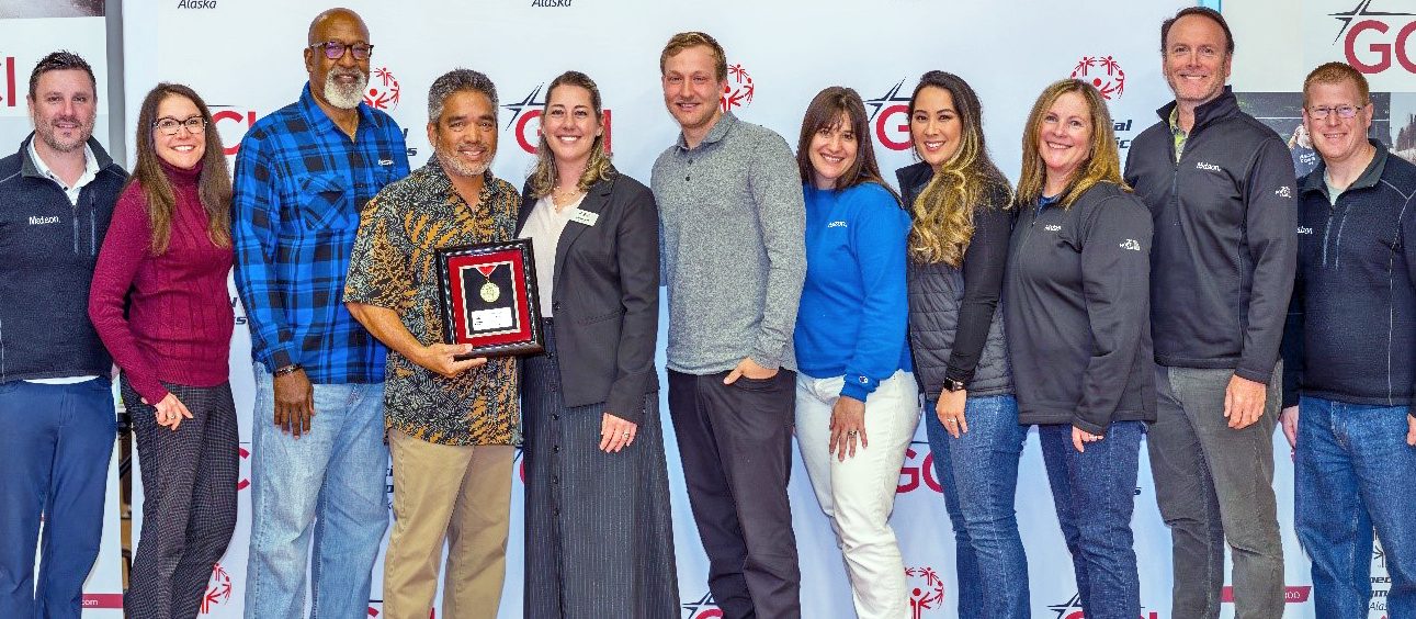 Team Matson accepts a framed medal honor from Special Olympics Alaska.