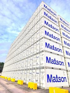 Matson containers stacked six containers high in the container yard.